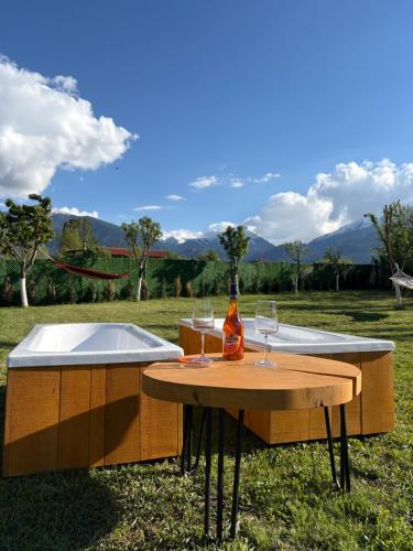 a table with two wine glasses on top of it at Loft Chalet Bansko in Bansko
