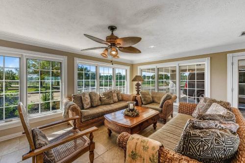 a living room with couches and a ceiling fan at Escape at the SK in Huntsville