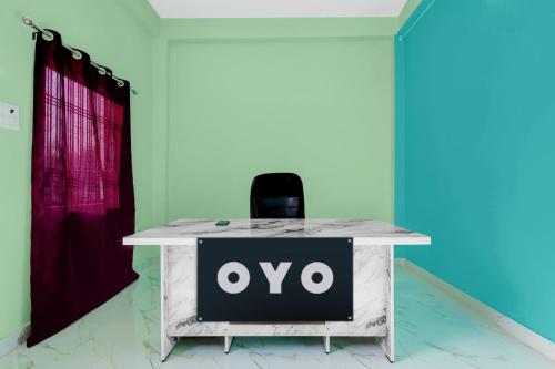 a white table with an ovo sign on it at Hotel O A2Z Hotel in Lucknow