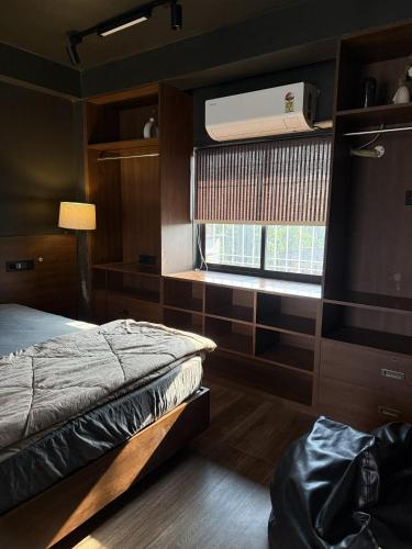 a bedroom with a bed and a window at Terrace By Opal in Barābhīta