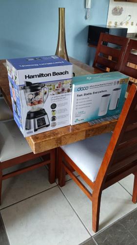 two boxes sitting on top of a table at NSI Casa Entera en La Piedad in San Juan del Fuerte