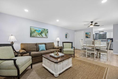 a living room with a couch and chairs and a table at 8A Amelia Landings Condo in Fernandina Beach