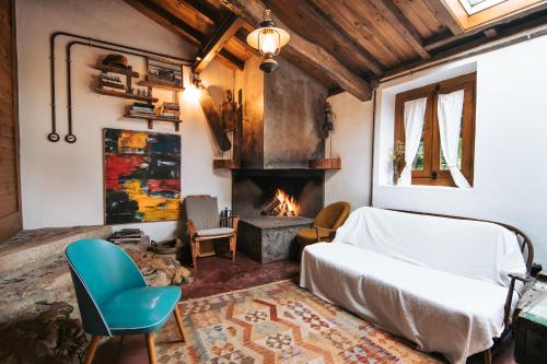 a bedroom with a bed and a fireplace at Terra Lodge in Ericeira