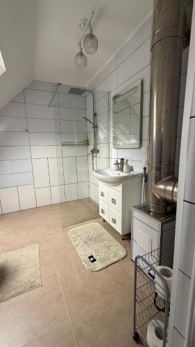 a small kitchen with a sink and a sink at Три сосни in Kosiv