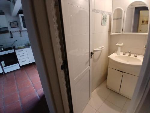 a bathroom with a toilet and a sink at Casa Quinta Marie Rose in Mercedes