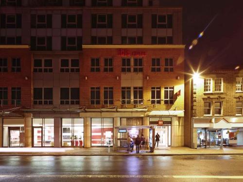 a store front of a building at night at ibis Reading Centre in Reading