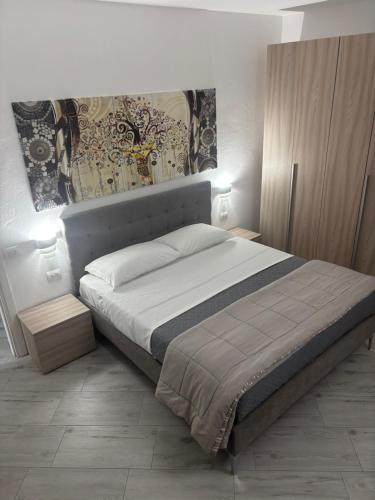 a bedroom with a large bed in a room at House 149 in Ferrara