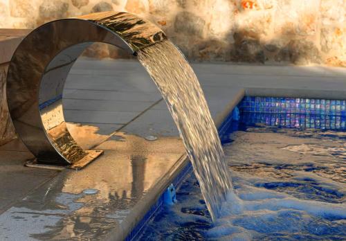 a pool of water coming out of a water fountain at Old Town Oasis in Dubrovnik