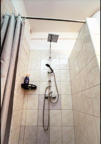 a shower in a bathroom with a shower at NiKi in Patince