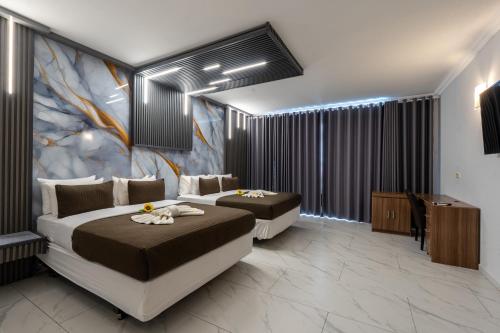 Krevet ili kreveti u jedinici u okviru objekta New Elegance hotel