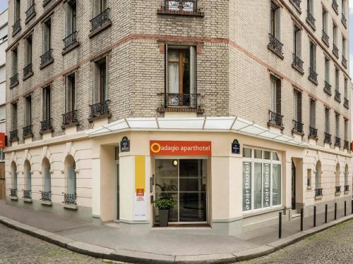 a building on the side of a street at Aparthotel Adagio Access Paris Philippe Auguste in Paris