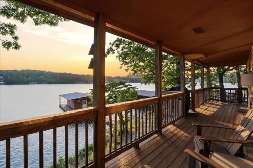 a porch of a cabin with a view of the water at Emerald waters in Camdenton