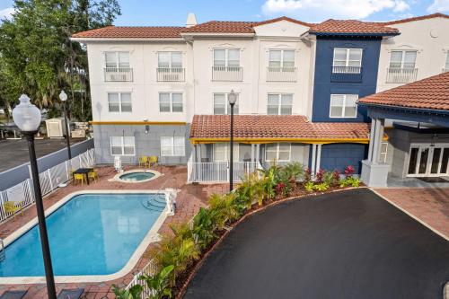 a swimming pool in front of a building at City Express by Marriott St. Augustine in St. Augustine