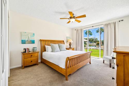 a bedroom with a bed and a window at HP 124 Condo by 30A Escapes in Rosemary Beach