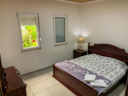 a bedroom with a bed and a window at Lake of Diber in Debar