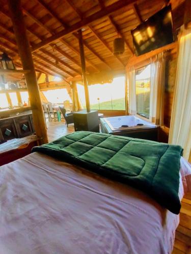 a bedroom with a bed and a pool table at De oio no arroio in Cambará