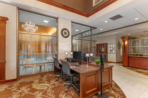 an office with a desk and chairs in a lobby at Best Western PLUS The Arden Park Hotel in Stratford