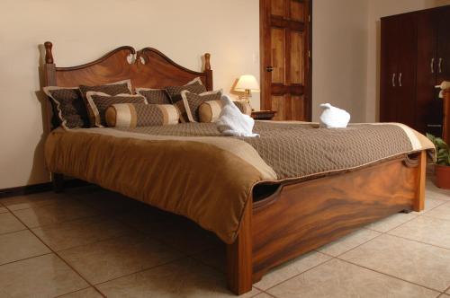 Ένα ή περισσότερα κρεβάτια σε δωμάτιο στο Hotel Las Brumas