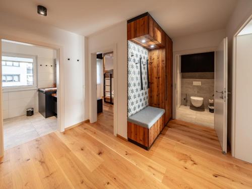 a bathroom with a bench in the middle of a room at Mariazeller Zirbennest in Mariazell