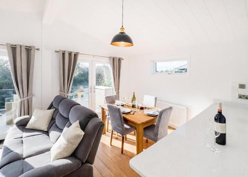 a living room with a couch and a table at Foxhunter Park in Kent