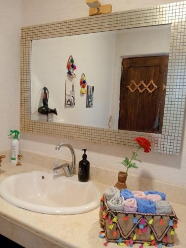 a bathroom counter with a sink and a mirror at Siwa Spot - Authentic Siwan Room with Private Patio in Siwa