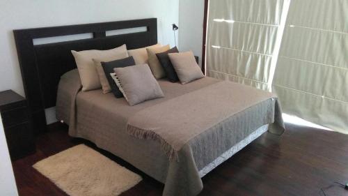 A bed or beds in a room at Casas Condominio Pingueral