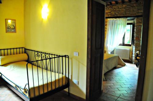 Кровать или кровати в номере Agriturismo Popolano Di Sotto