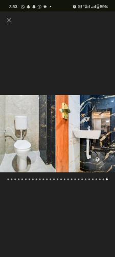 a bathroom with a toilet and a sink at Kanakplace in Indore