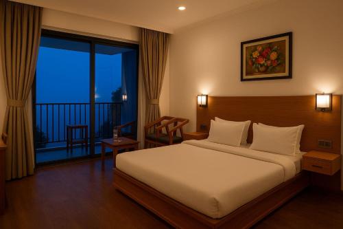 a hotel room with a bed and a balcony at Serene Forest Resort in Nainital