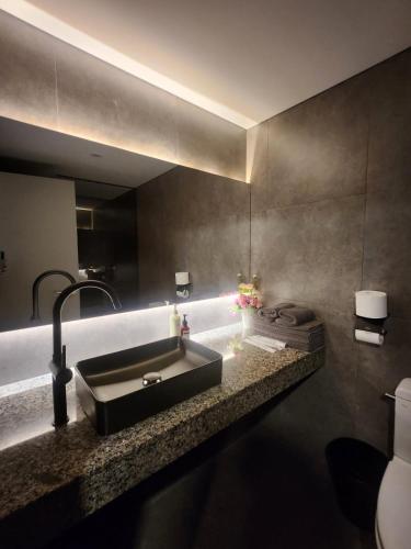 a bathroom with a sink and a toilet at Glocaloca gwanghwamun in Seoul