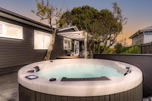 a hot tub in the backyard of a house at 19 Broadway in Martinborough