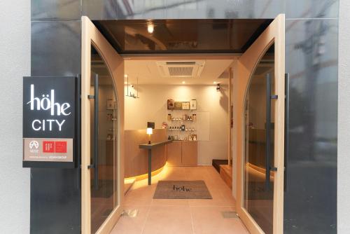 a store front with a window with a halo city sign at Hohe City Dongdaemun in Seoul