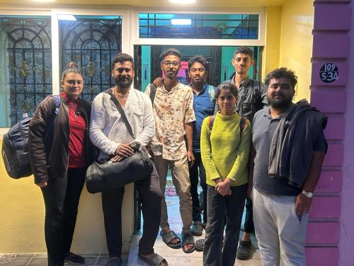 a group of people standing in front of a building at CR Private Villa in Tiruvannāmalai