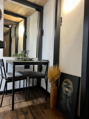 a dining room with a table and a chair at A corner by the sea in Ashdod