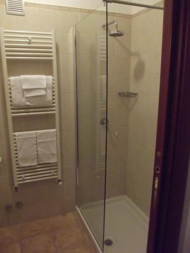 a shower with a glass door in a bathroom at Agriturismo AgriCostella Vieste, Piscina e Parcheggio in Vieste