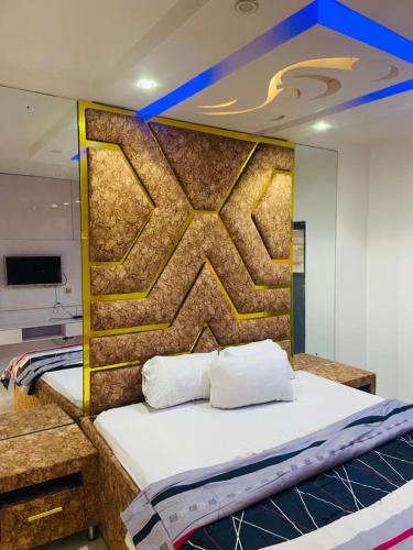 a bed with two pillows on it in a room at Double Homes in Agbelekale