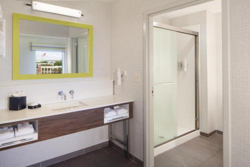 a bathroom with a sink and a mirror at Hampton Inn & Suites Natchez in Natchez