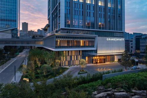a rendering of the grand hotel at dusk at Grand Hyatt Kunming in Kunming