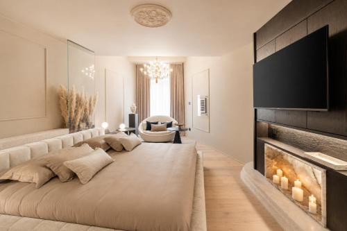a bedroom with a large bed and a fireplace at La Villa Residence in Rovinj