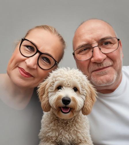a man and a woman holding a small dog at Hasi-Stübchen in Geldern