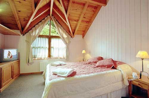Una cama o camas en una habitación de Apart Torres Del Sur