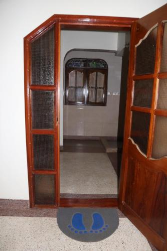 an open door to a room with a room with a door at The Paradise In Kilimanjaro in Moshi