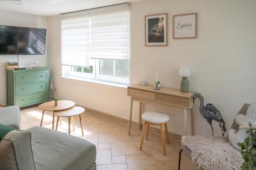 a living room with a bird sitting on a table at Strandhaus 134 in Mönkebude