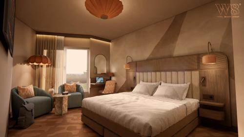a bedroom with a bed and a chair and a window at Strand Öland in Borgholm