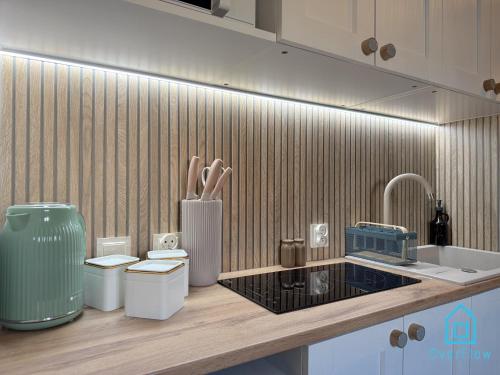 a kitchen with two toilets and a sink and a counter at Casa Verde Apartment at Old Town Gdańsk in Gdańsk