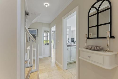 a hallway with a staircase in a home at Haus Meerblick in Rantum