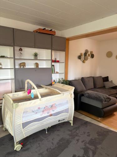 a living room with a bed and a couch at Ferienhaus an den Eichen in Aschersleben