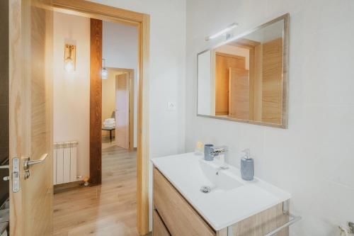 a bathroom with a sink and a mirror at El Trillo in Marlín