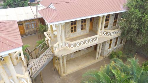 an overhead view of a building with a red roof at The Paradise In Kilimanjaro in Moshi
