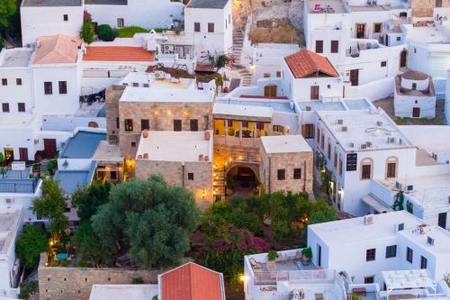 an aerial view of a town with white buildings at Vasilikos Mansion - Captains Residences in Lindos